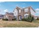 Charming two-story brick home with manicured landscaping at 13750 Hiatt Dr, Carmel, IN 46074