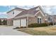 Exterior view of a two-car garage with a concrete driveway at 13750 Hiatt Dr, Carmel, IN 46074