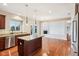 Modern eat-in kitchen with island, stainless steel appliances and hardwood flooring at 13750 Hiatt Dr, Carmel, IN 46074