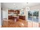 Eat-in kitchen with stainless steel appliances, wood floors, island and slider to deck at 13750 Hiatt Dr, Carmel, IN 46074