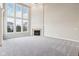 Spacious living room featuring a fireplace, tall windows and neutral decor at 13750 Hiatt Dr, Carmel, IN 46074