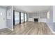 Spacious living room boasts hard surface floors, a fireplace, large windows and is freshly painted at 1611 Orchard Ln, Anderson, IN 46011