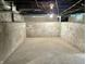 Spacious unfinished basement with concrete floor and walls, ready for customization and ample storage at 1640 Bellefontaine St, Indianapolis, IN 46202