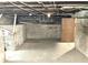 Unfinished basement with concrete foundation and utilities visible; opportunity for personalized renovation at 1640 Bellefontaine St, Indianapolis, IN 46202