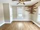 Bedroom featuring wood-look floors, neutral walls, ceiling fan and accent decor at 1640 Bellefontaine St, Indianapolis, IN 46202
