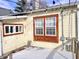 Exterior shot of the house, showcasing the windows and string lights illuminating the back porch at 1640 Bellefontaine St, Indianapolis, IN 46202