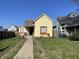 Charming yellow single Gathering home with a cozy porch and well-kept front yard, great curb appeal at 1640 Bellefontaine St, Indianapolis, IN 46202