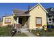 Charming yellow single Gathering home with a cozy porch and well-kept front yard, great curb appeal at 1640 Bellefontaine St, Indianapolis, IN 46202