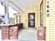 Charming home featuring a covered front porch supported by red brick pillars and a screened door at 1640 Bellefontaine St, Indianapolis, IN 46202