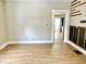 Open living room showing wood-look floors and kitchen view at 1640 Bellefontaine St, Indianapolis, IN 46202