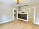 Wide angle of a living room with wood-look floors and light-filled doorways at 1640 Bellefontaine St, Indianapolis, IN 46202