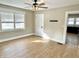 View of light-filled living room featuring wood-look floors and a modern ceiling fan at 1640 Bellefontaine St, Indianapolis, IN 46202