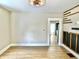 Open living room showing recessed lighting, wood-look floors and kitchen view at 1640 Bellefontaine St, Indianapolis, IN 46202