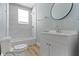 Full bathroom featuring updated vanity, mirror, and shower/tub combo at 19 Parkview Ave, Indianapolis, IN 46201