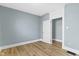 Bedroom features new hardwood floors and neutral paint, ready for its next owner at 19 Parkview Ave, Indianapolis, IN 46201