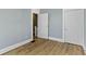 Bedroom features new hardwood floors and neutral paint, ready for its next owner at 19 Parkview Ave, Indianapolis, IN 46201