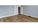 Bedroom features new hardwood floors and neutral paint, ready for its next owner at 19 Parkview Ave, Indianapolis, IN 46201