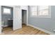 Hallway featuring hardwood floors and multiple doorways at 19 Parkview Ave, Indianapolis, IN 46201