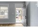 Interior view featuring hardwood flooring and a glimpse of the front porch through the open door at 19 Parkview Ave, Indianapolis, IN 46201