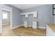 Open kitchen featuring modern white cabinetry and countertops at 19 Parkview Ave, Indianapolis, IN 46201