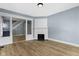 Inviting living room features hardwood floors, a fireplace and an open staircase at 19 Parkview Ave, Indianapolis, IN 46201