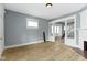 Spacious living room featuring an open staircase and a cozy fireplace at 19 Parkview Ave, Indianapolis, IN 46201
