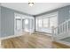 Open living room with hardwood floors, large windows, and stylish white trim at 19 Parkview Ave, Indianapolis, IN 46201