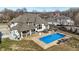 Aerial view of a backyard with a sparkling pool, outdoor kitchen, and lounge area at 2071 Eagle Trace Dr, Greenwood, IN 46143