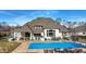 Aerial view of the pool with an outdoor kitchen and bar, with outdoor seating at 2071 Eagle Trace Dr, Greenwood, IN 46143