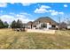 Spacious backyard with a large patio, lounge chairs and outdoor seating at 2071 Eagle Trace Dr, Greenwood, IN 46143