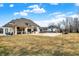 Large backyard with an outdoor bar and kitchen area adjacent to the in-ground pool at 2071 Eagle Trace Dr, Greenwood, IN 46143