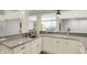 Elegant bar area features granite countertops, white cabinetry, and a black sink with a modern faucet at 2071 Eagle Trace Dr, Greenwood, IN 46143