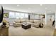 The basement area boasts a large sectional sofa and a stylish coffee table, ideal for relaxing and entertaining at 2071 Eagle Trace Dr, Greenwood, IN 46143