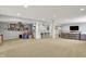 Spacious finished basement with a bar area featuring a granite countertop and seating for entertaining guests at 2071 Eagle Trace Dr, Greenwood, IN 46143