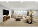 Finished basement with a neutral color palette, plush carpet, and ample natural light from several windows at 2071 Eagle Trace Dr, Greenwood, IN 46143