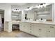Bathroom with a double vanity with vessel sinks, large mirrors, and modern lighting fixtures at 2071 Eagle Trace Dr, Greenwood, IN 46143