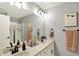 Bright bathroom showcasing a double sink vanity and decorative wall art at 2071 Eagle Trace Dr, Greenwood, IN 46143