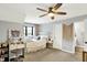 Bedroom with a white bed, vanity table, ceiling fan, and access to the bathroom at 2071 Eagle Trace Dr, Greenwood, IN 46143