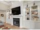 Custom built-ins flanking a fireplace create a cozy focal point in the living room at 2071 Eagle Trace Dr, Greenwood, IN 46143