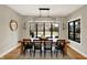 Dining room features modern chandelier, large windows with backyard view and seating for six at 2071 Eagle Trace Dr, Greenwood, IN 46143