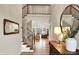 Spacious foyer with hardwood floors, staircase, and views into the living room at 2071 Eagle Trace Dr, Greenwood, IN 46143