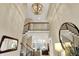 Bright foyer featuring tall ceilings, hardwood floors, and a view into the open-concept living area at 2071 Eagle Trace Dr, Greenwood, IN 46143