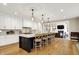 Spacious kitchen featuring a large island with pendant lighting, stainless steel appliances, and light wood flooring at 2071 Eagle Trace Dr, Greenwood, IN 46143