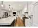 Modern kitchen features stainless steel appliances, marble countertops, island seating, and open-concept design at 2071 Eagle Trace Dr, Greenwood, IN 46143