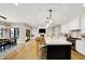Bright, open kitchen with stainless steel appliances, a large island with seating, and pendant lighting at 2071 Eagle Trace Dr, Greenwood, IN 46143