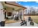 Expansive covered patio with outdoor seating, ceiling fan, and fireplace at 2071 Eagle Trace Dr, Greenwood, IN 46143