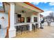 Covered patio with bar seating, stainless steel grill, and ceiling fan at 2071 Eagle Trace Dr, Greenwood, IN 46143