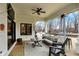 Relaxing covered patio with comfortable seating, ceiling fan, and outdoor heater at 2071 Eagle Trace Dr, Greenwood, IN 46143