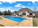 Backyard with a large swimming pool, diving board, and outdoor seating area at 2071 Eagle Trace Dr, Greenwood, IN 46143
