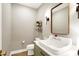 Charming powder room with decorative fixtures, wall art, and an elegant sink at 2071 Eagle Trace Dr, Greenwood, IN 46143